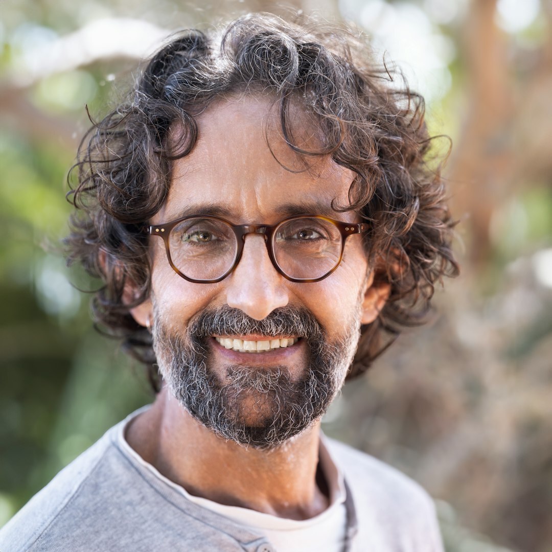 Mature male journalist with glasses